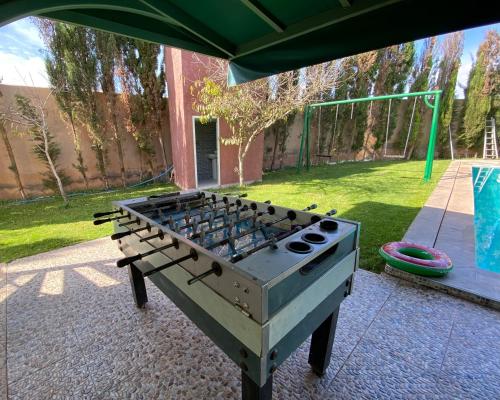 an outdoor grill with a large stove top ovenituresitures at Villa avec piscine à Agadir tifnit surf in Agadir