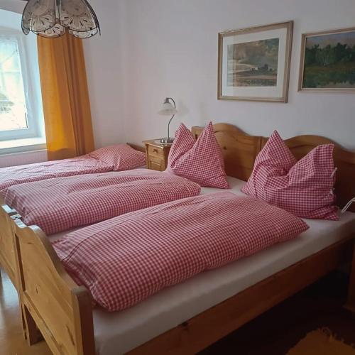 two beds sitting next to each other in a bedroom at Ubytování ve Mlýně in Kladenské Rovné