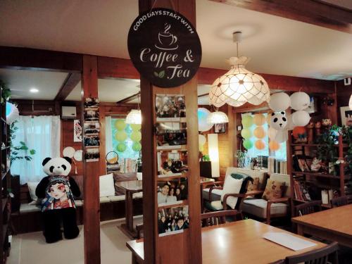a restaurant with a panda and ted sign in a room at 一棟貸し 露天風呂付き Snowfall Meteor in Kaminoyama