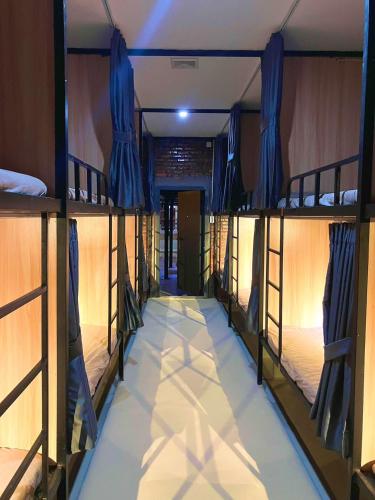 a row of bunk beds in a room at Venn Hostel in Vientiane