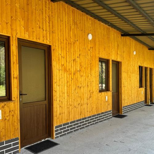 a row of doors on the side of a building at Januka Studio in Stepantsminda