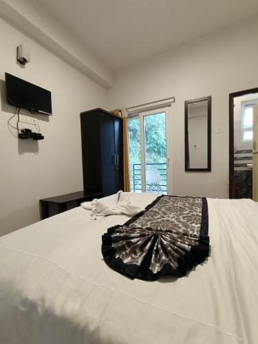 Postel nebo postele na pokoji v ubytování Hotel Karma Kastle