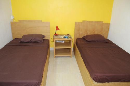 Postel nebo postele na pokoji v ubytování Souillac-Guest House