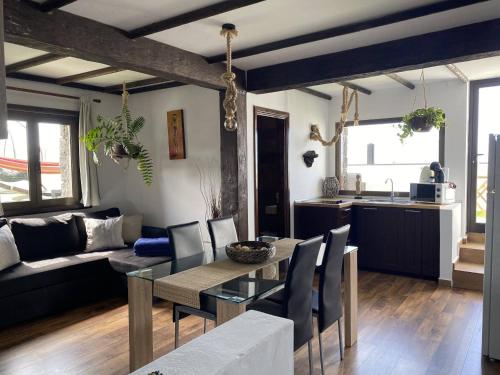 a living room with a table and a kitchen at Finca Marisa in Tinajo