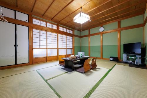 a large living room with a table and a tv at Yoshinogun - House - Vacation STAY 17051 in Yoshino