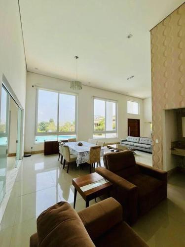 a large living room with a couch and a table at Casa-Condomínio-Itu-City Castelo in Itu