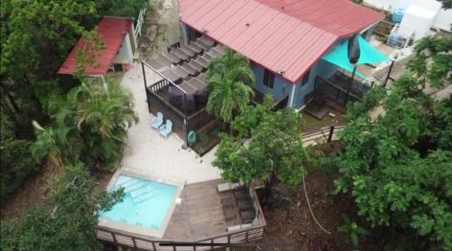 an aerial view of a house with a swimming pool at La Kolina Reserve in Ponce