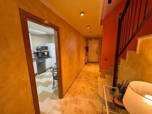 a hallway leading to a kitchen in a house at Casa Ribera del Pisuerga - Piscina privada in Arroyo de la Encomienda