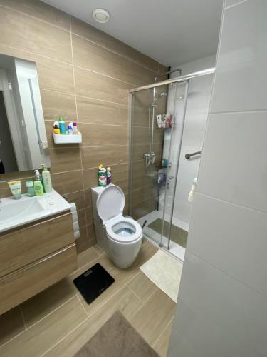 a bathroom with a toilet and a sink and a shower at Penthouse Palapagolf in Orihuela Costa