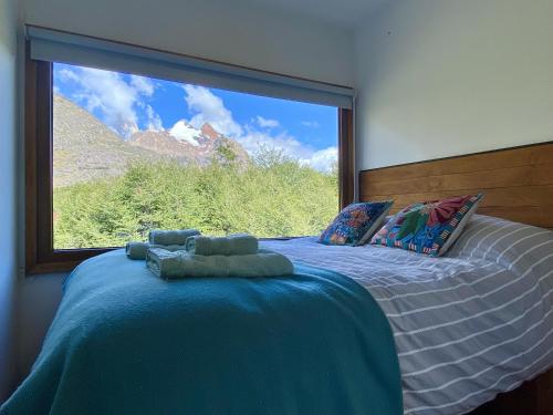 En eller flere senge i et værelse på Cerro Electrico - Off The Grid Tiny Houses