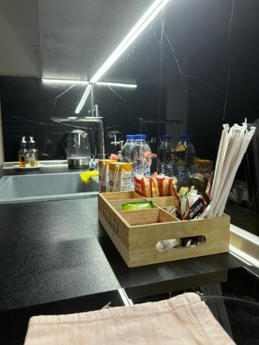 a box of food on a counter in a kitchen at eliTe deluxe 2 in Kavala