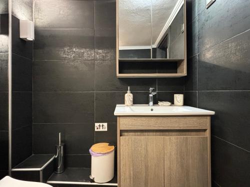 a small bathroom with a sink and a toilet at eliTe deluxe 2 in Kavala