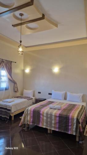 Una cama o camas en una habitación de Kasbah Ait BenHadda