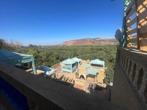 a view of a house from the balcony of a building at Extrait d'atlas in Tafza