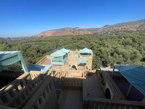 an aerial view of a house with mountains in the background at Extrait d'atlas in Tafza