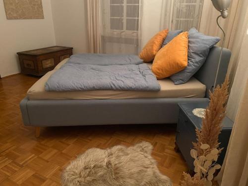 a couch with pillows on it in a living room at Im schönen Naheland bei Kirn in Meckenbach