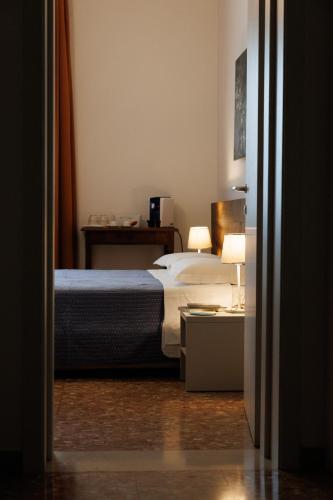 Postel nebo postele na pokoji v ubytování Balabuska Rooms & Garden