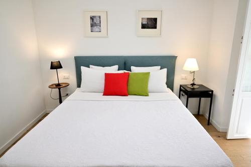 A bed or beds in a room at AT HOME COLOSSEO
