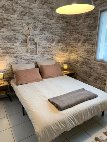 Ένα ή περισσότερα κρεβάτια σε δωμάτιο στο La Belle Escale