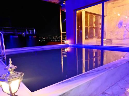 a view of a balcony with a light on a building at Wadhwani's Haveli villa in Royal Palms in Mumbai