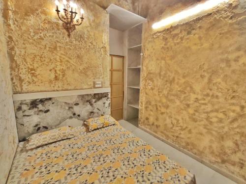 a bedroom with a bed and a wall at Wadhwani's Haveli villa in Royal Palms in Mumbai