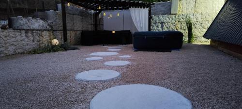 a group of stones on the ground in a patio at Stone Chalets - LUNA in Jajce