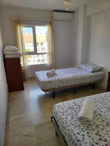 Postel nebo postele na pokoji v ubytování Diamond Room vue Pool Fuengirola 3