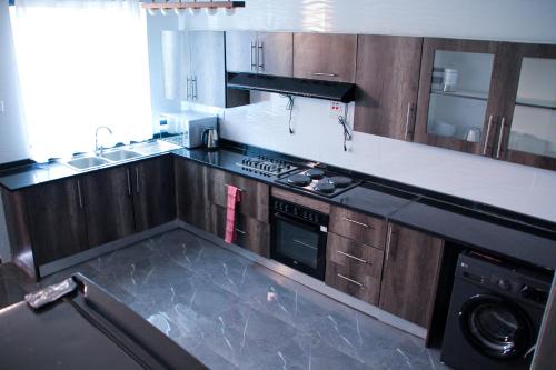 Η κουζίνα ή μικρή κουζίνα στο Patwalls Apartments