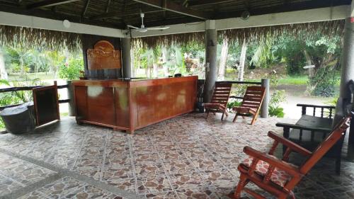 a room with chairs and a table and a podium at Playa Encantada in Las Casitas