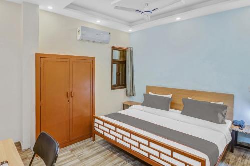 Postel nebo postele na pokoji v ubytování Capital O Moody Inn