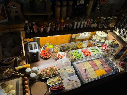 an overhead view of a buffet of food on a table at Pension U Draka in Karlovy Vary