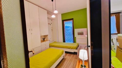 Ένα ή περισσότερα κρεβάτια σε δωμάτιο στο Il nido Santa Maria Maggiore Condominio Hermitage