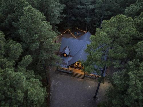 an overhead view of a house in the woods at NewListing! 1-Mile Choctaw Landing, GameRoom, 6BR, Sleep-18, PET Friendly, HotTub, Play Structure, Smart TV, FirePit, Outdoor in Stephens Gap