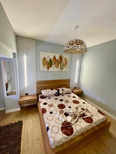 a bedroom with a large bed in a room at Your home Fier 1 in Fier