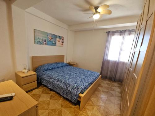 Voodi või voodid majutusasutuse Chalet Tiziana ~ Una veranda sul mare ~ toas
