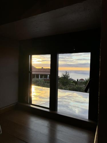a window in a room with a view at Victoria Tiny Stone House in Ponta do Pargo