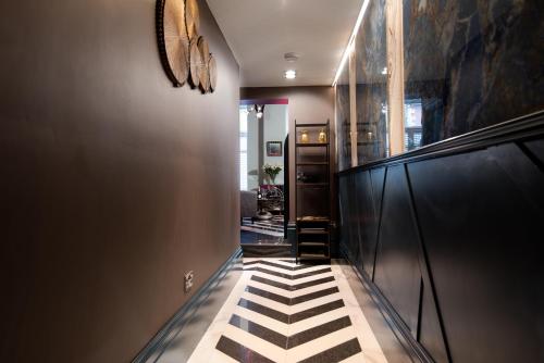 a hallway with a black and white checkered floor at The Saafe luxury apartments in Berwick-Upon-Tweed