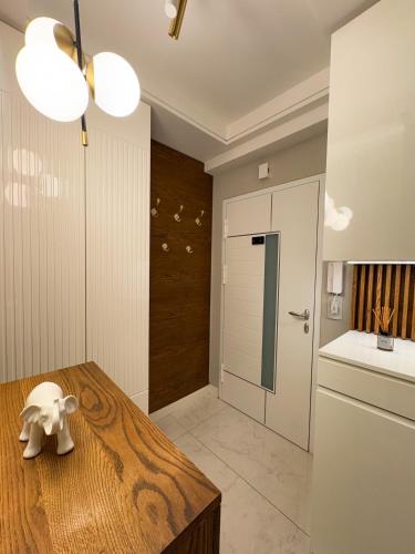 a kitchen with a table with a toy elephant on it at Apartman Madness in Bijeljina