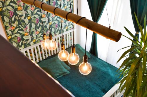 a group of light bulbs hanging from a rail at Green Garden Děčín in Děčín