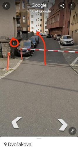 a street with cars parked in a parking lot at MINATO Apartments Ostrava center in Ostrava