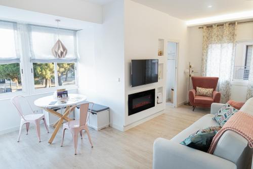 a living room with a couch and a table at Apartamento Figueres Plaza Cataluña in Figueres