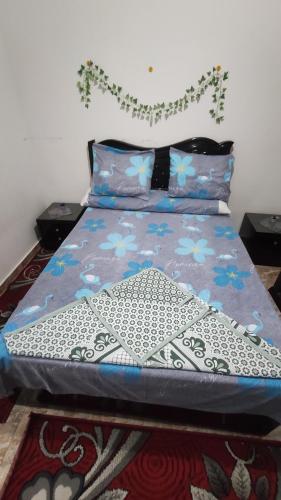 A bed or beds in a room at the flowers apartment
