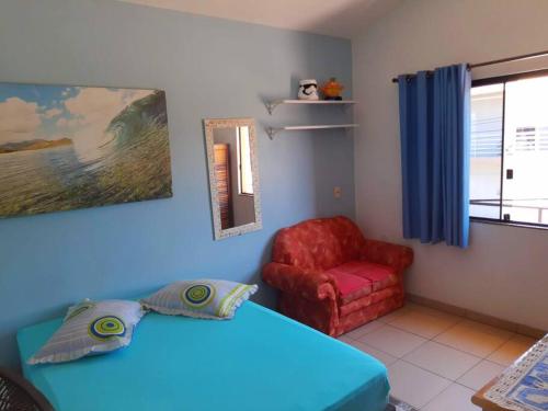 Ένα ή περισσότερα κρεβάτια σε δωμάτιο στο Casa da Jô Garopaba