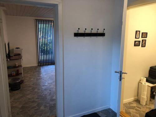 a hallway with a door open to a room at Zoo apartment tæt på Legoland, Lego-house, lalandia in Grindsted