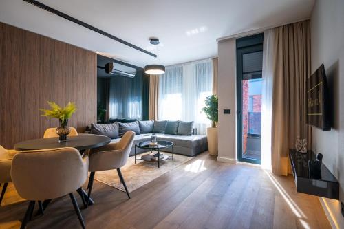 a living room with a couch and a table at The Residence 59 in Belgrade
