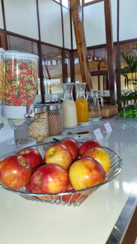 a plate of apples and other food on a table at Hotel ACA Eldorado in Eldorado