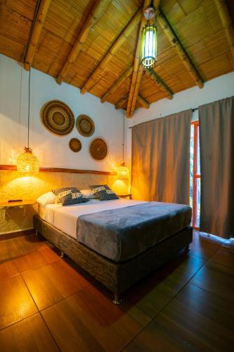 Postel nebo postele na pokoji v ubytování Hotel Campestre LA ALDEA