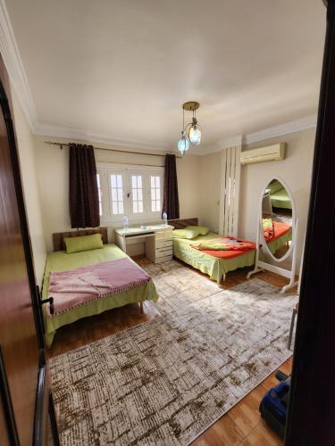 Voodi või voodid majutusasutuse Apartment in front of Mansoura University 5 stars toas