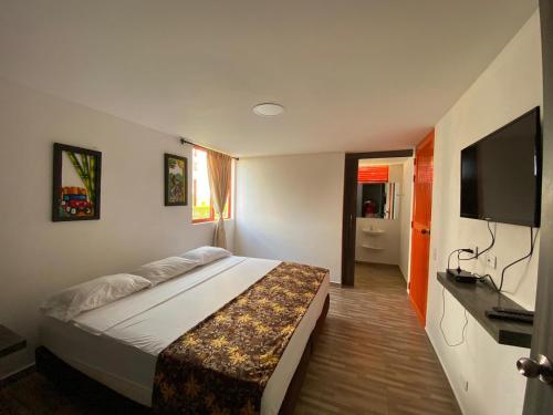 Postel nebo postele na pokoji v ubytování Hotel Campestre LA ALDEA