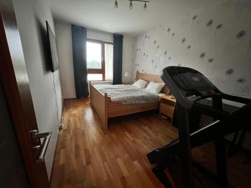 a small bedroom with a bed and a window at Mattioliho Apartment in Prague